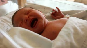 stock-footage-a-new-born-baby-cries-in-its-crib